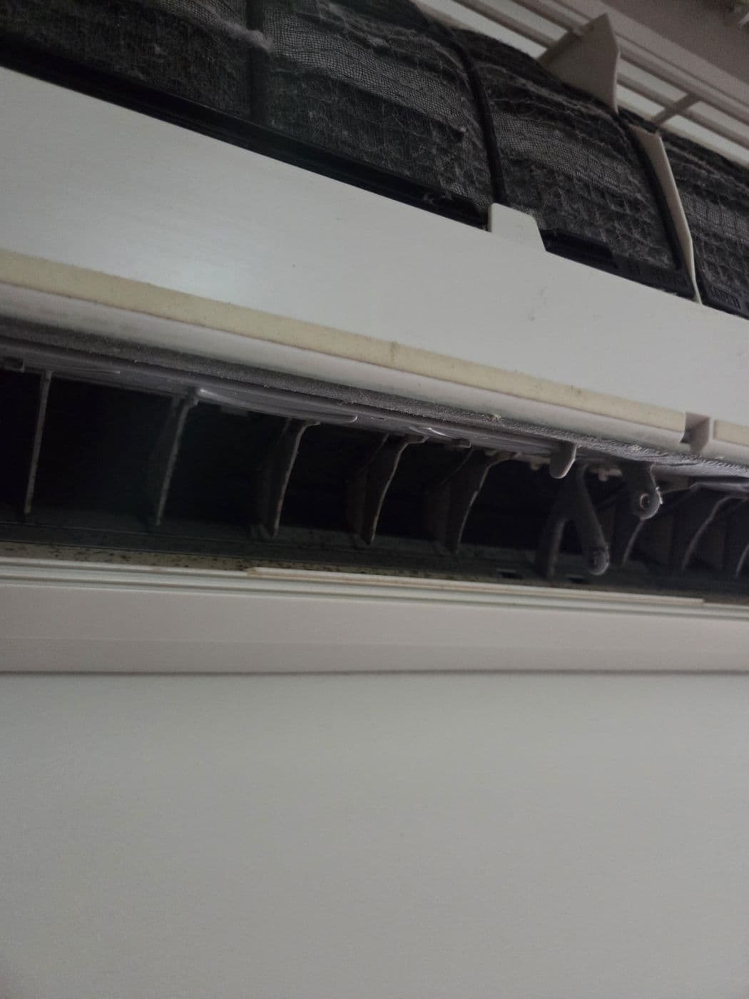 Split system indoor unit filter open for servicing
