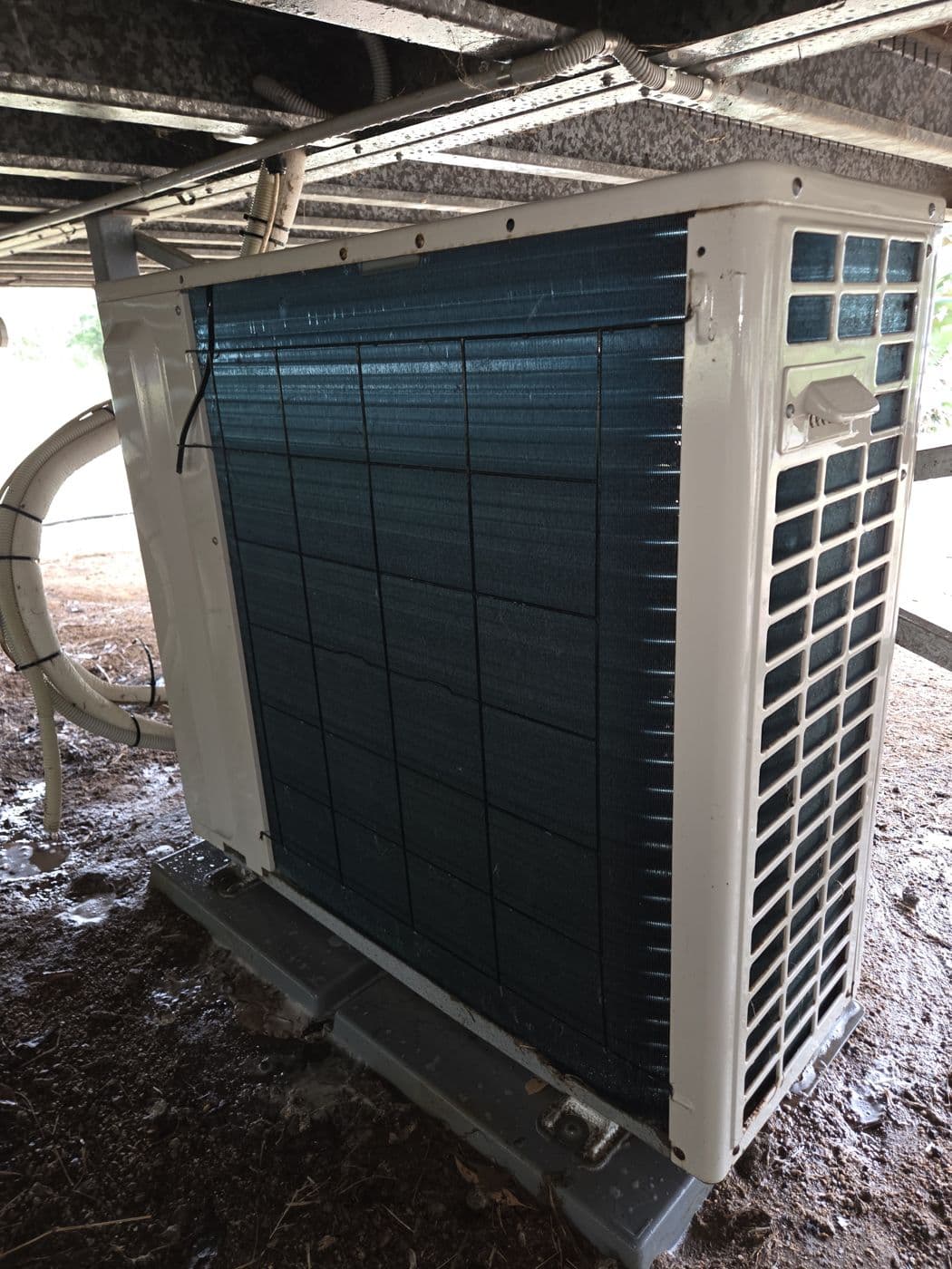 Outdoor split system condenser unit installed on site