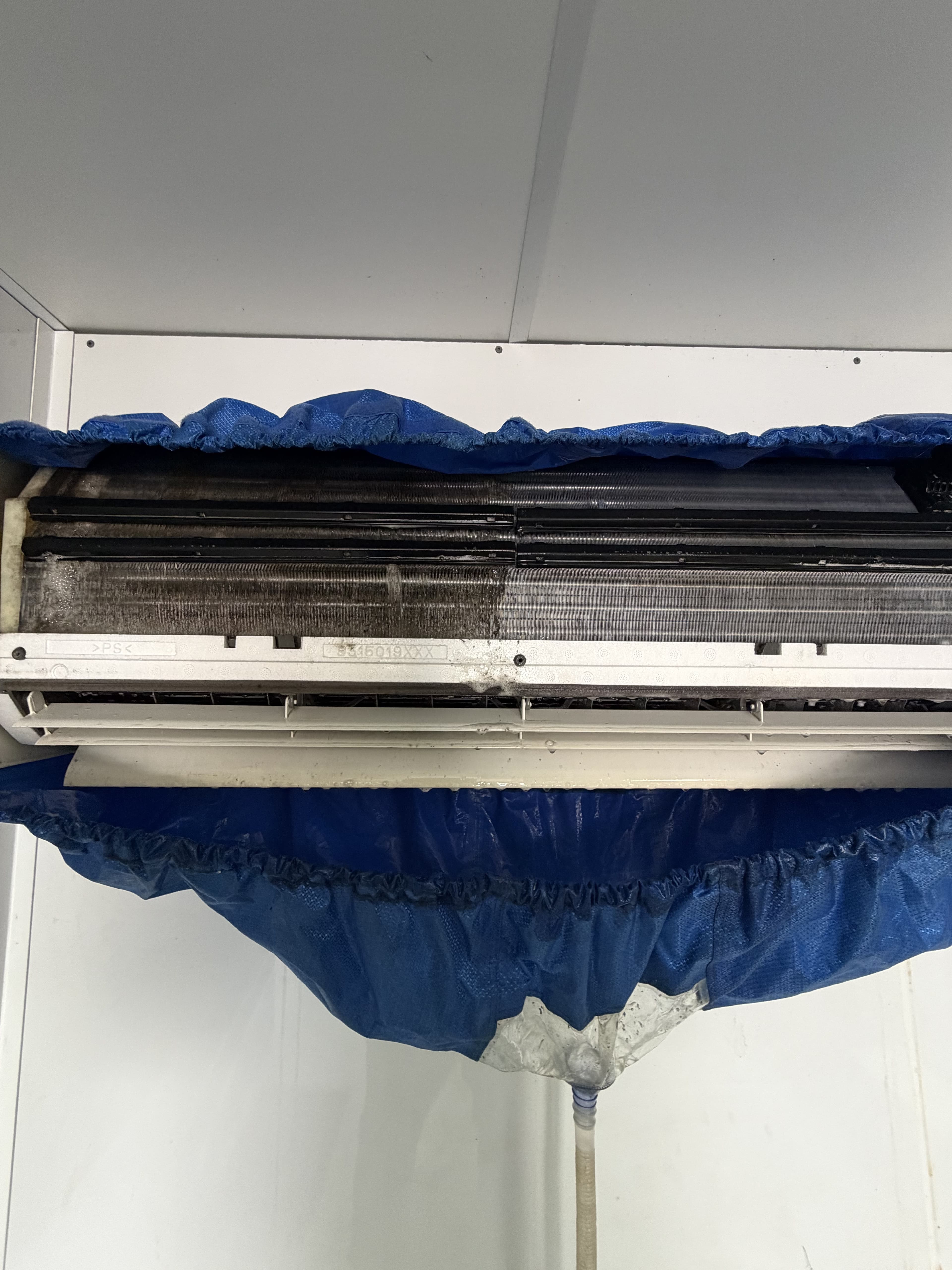 Split system front housing and filters removed for a thorough deep clean