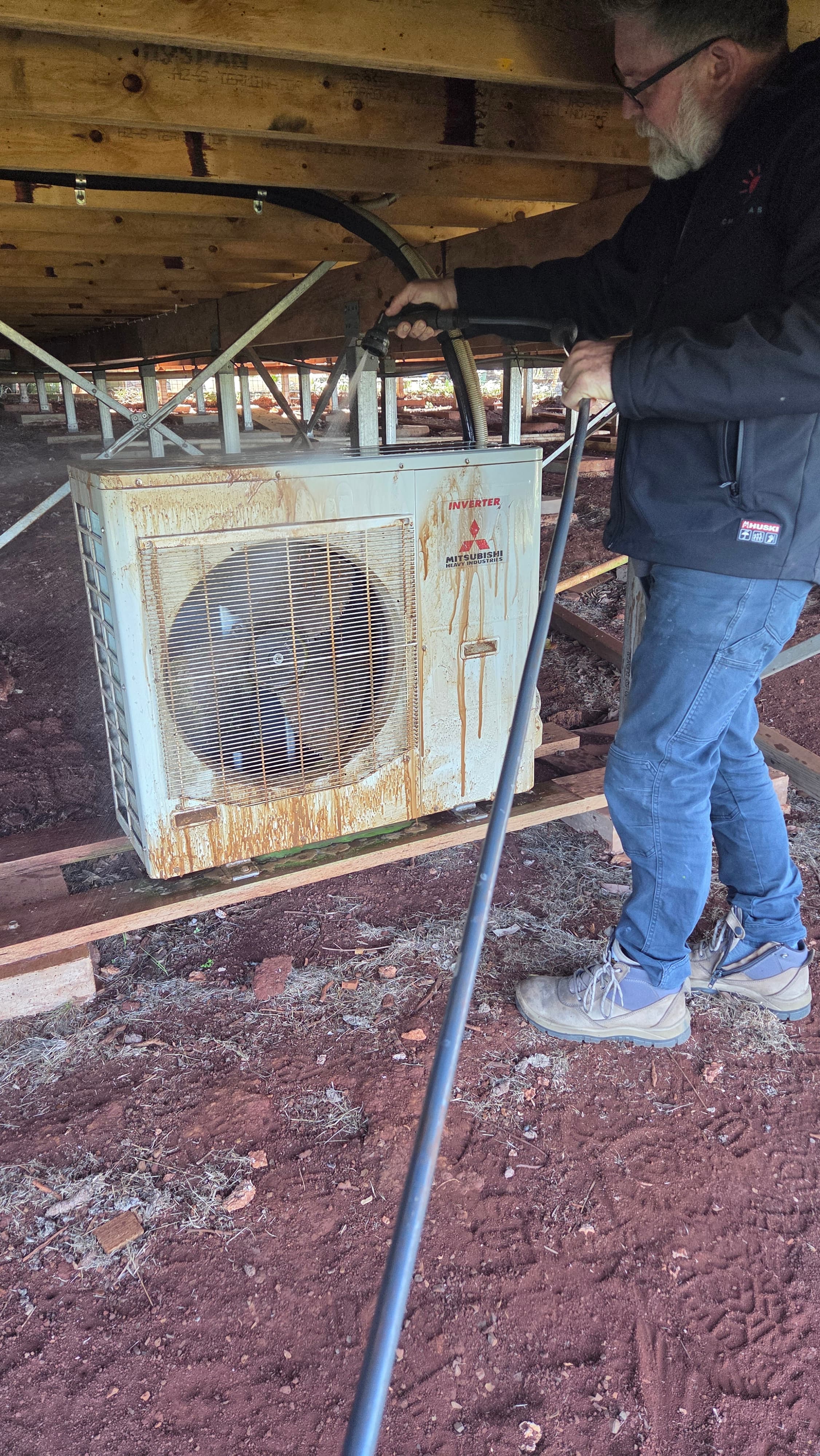 Jon from Chilled As Air Conditioning servicing an outdoor split system unit