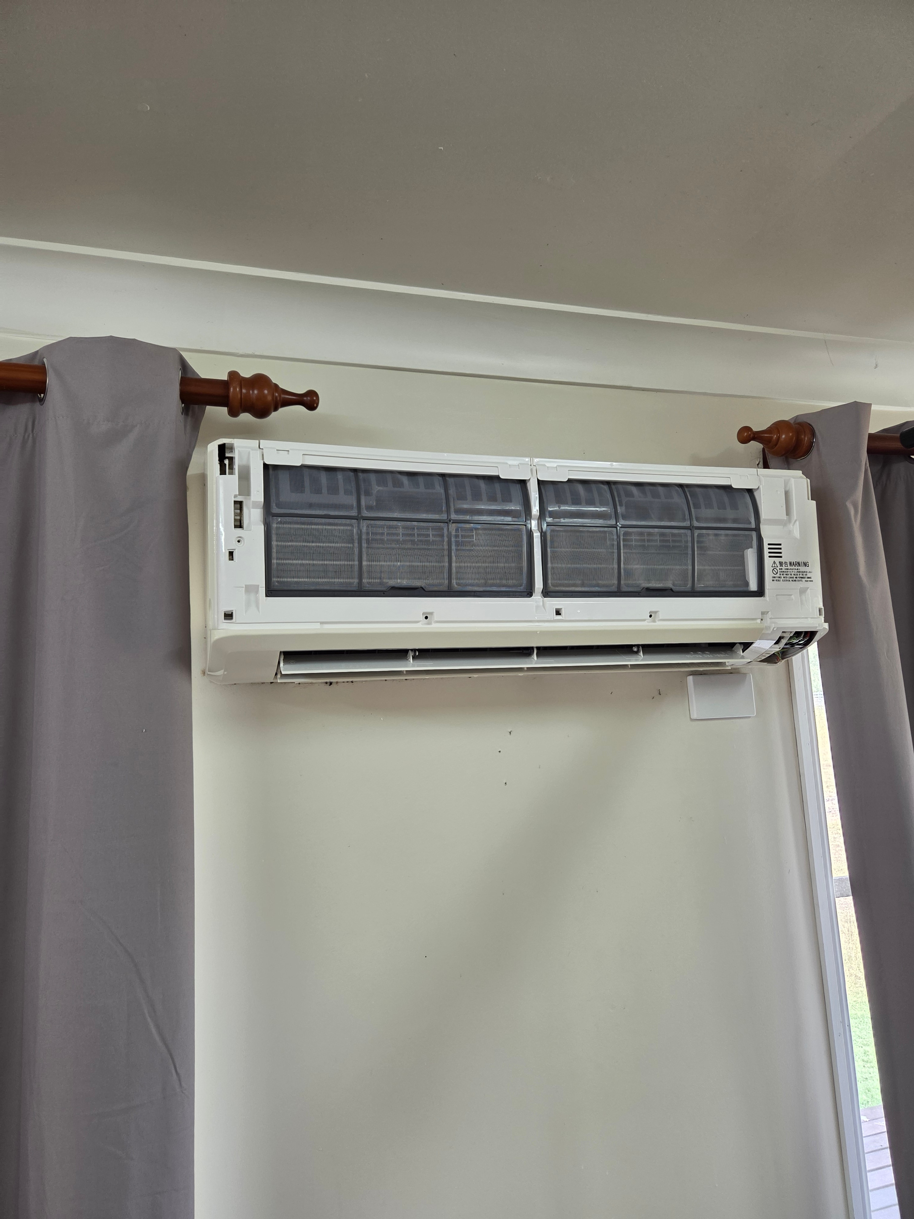 Split system indoor unit installed on a living room wall by Chilled As Air Conditioning